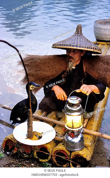 China, Guangxi province, cormorant fisherman