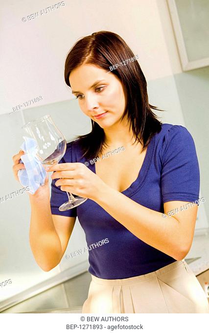 Woman cleaning glass