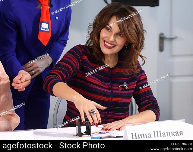 RUSSIA, MOSCOW - DECEMBER 15, 2023: Singer Nina Shatskaya cancels postage stamps during a ceremony at the AVM Media broadcasting centre to mark 60 years since...