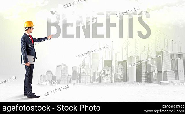 Young businessman with hard hat and BENEFITS inscription, new business opportunity concept