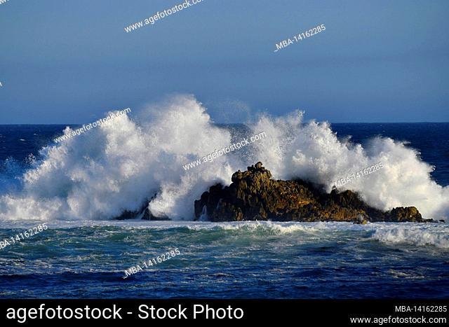 wave breaking on coastal rocks, kleinmond, south africa