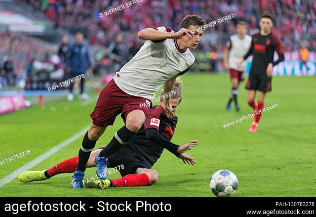 Benjamin Pavard (FC Bayern Munich) escapes Tin Jedvaj (FC Augsburg) GES / Football / 1.Bundesliga: FC Bayern Munich - FC Augsburg, 08.03
