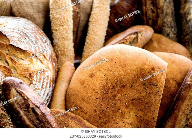 Cropped image of different types of bread