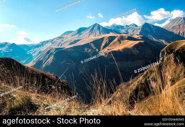 mountain landscape with blue sky and clouds in Georgia in autumn