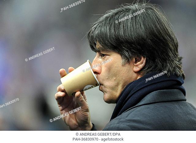 Germany's head coach Joachim Loew drinks a coffee prior to the international friendly soccer match France vs. Germany at the Stade de France in Paris, France