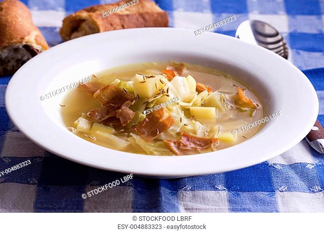Cabbage and potato soup with bacon and caraway