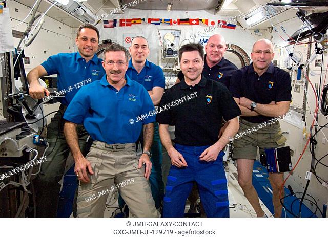 Expedition 2930 and Expedition 3031 crew members pose for a group portrait in the International Space Station's Kibo laboratory following the ceremony of...