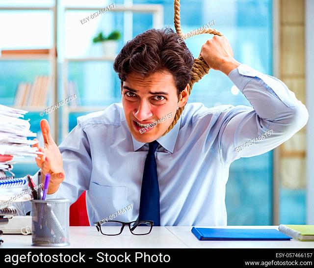 The unhappy businessman thinking of hanging himself in the office