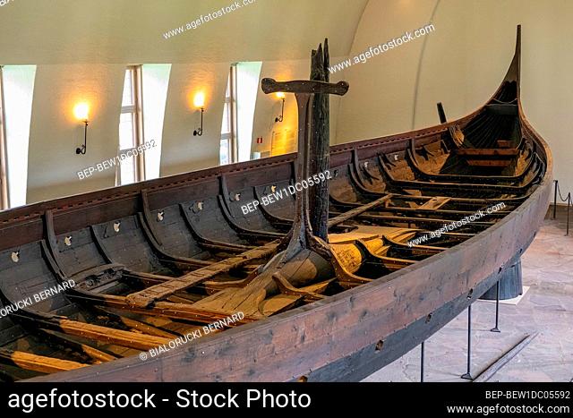 Oslo, Ostlandet / Norway - 2019/08/31: Gokstad ship excavated from ship burial archeological site, exhibited in Viking Ship Museum on Bygdoy peninsula of Oslo