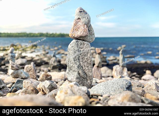 close up of stone pyramids or towers on beach
