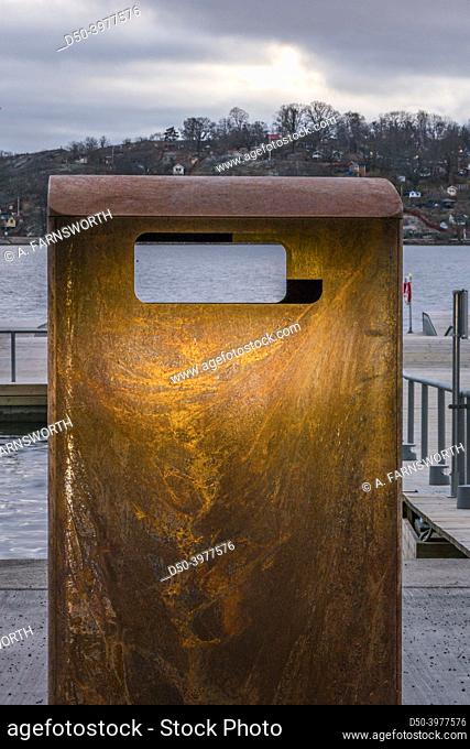 Stockholm, Sweden A garbage can made of rusted metal in Liljeholmskajen