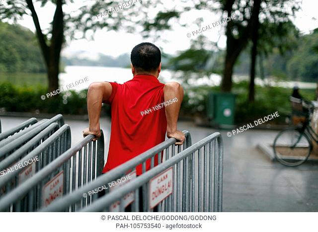 Morning street exercise on the banks of Hoan Kiem Lake. Hanoi. Vietnam. | usage worldwide. - Hanoi/Hanoi/Vietnam