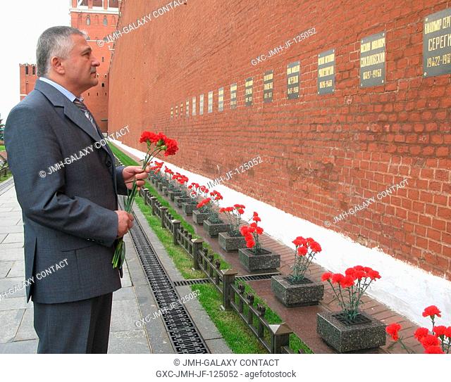 At the Kremlin Wall in Moscow, Russian cosmonaut Fyodor Yurchikhin, Soyuz commander, pays homage to Russian space icons buried in Red Square during a...