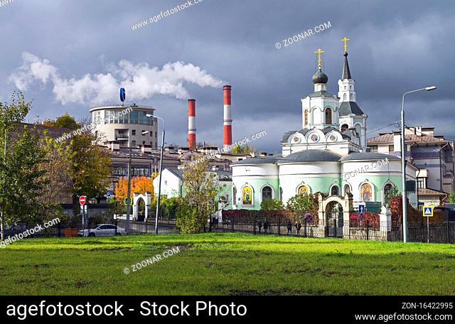 Moscow contrasts - building in the style of constructivism, the smoking chimneys of the power station and the old Orthodox Church next to each other against the...