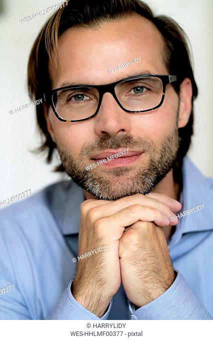 Portrait of confident man wearing glasses