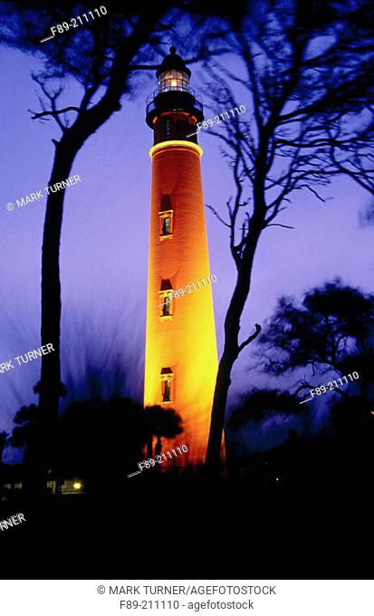 Ponce de Leon lighthouse illuminated at dusk. Ponce Inlet, Florida. USA