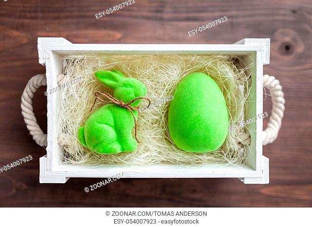 Traditional Easter holiday basket with a bunny and eggs