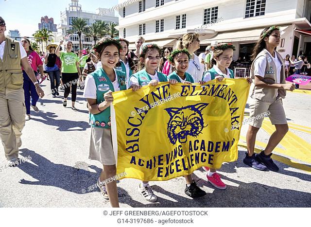 Florida, Miami Beach, Ocean Drive, Veterans Day Parade activities, Girl Scouts troop marching banner, Black, Biscayne elementary school