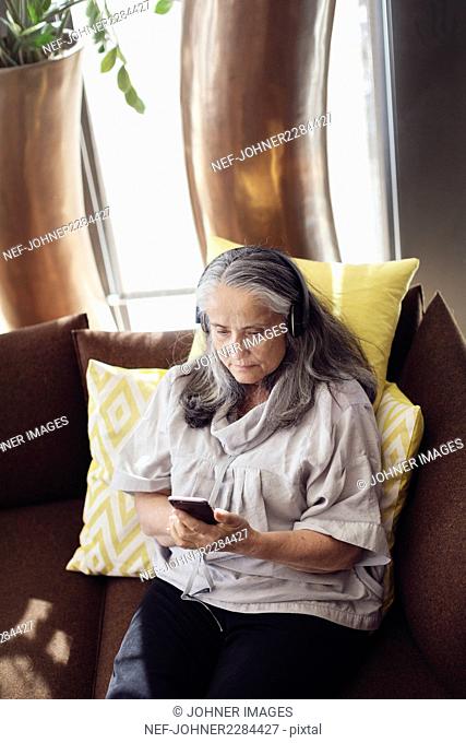 Mature woman using cell phone
