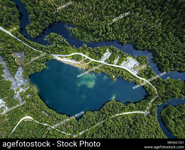 Russia, Republic of Karelia, Sortavala, Aerial view of green forest surrounding marble quarry, Lake Light and Tohmajoki river in summer