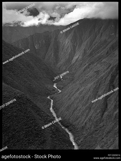 River flowing among majestic, rugged mountains, Machu Picchu, Peru