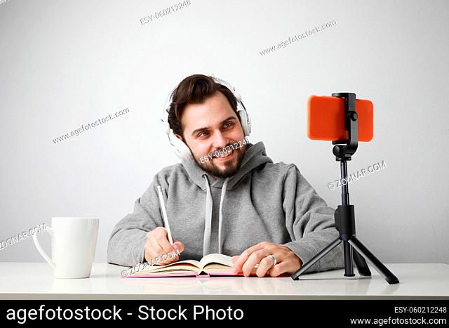 Headshot of bearded man studying online. Video conference via smartphone. High quality photo