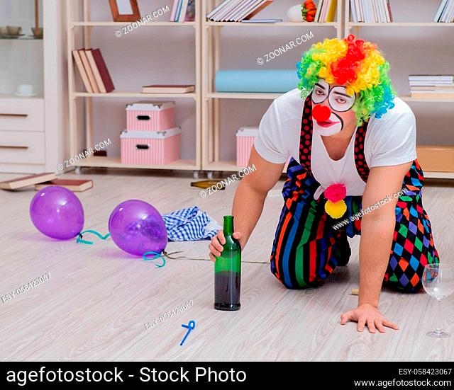The drunk clown celebrating having a party at home