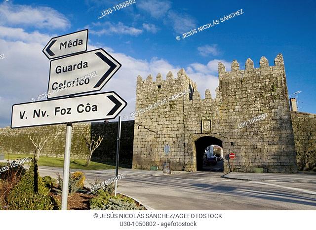 Trafgic signal in fornt of the entrance of castle walls in Trancoso village, in Beira Alta  Guarda District  Portugal