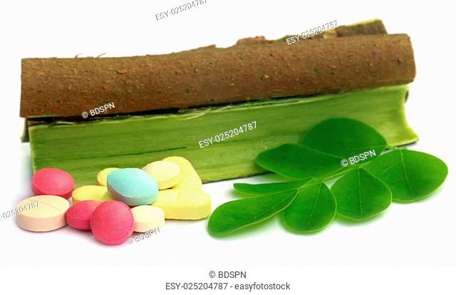 Moringa leaves and bark with pills