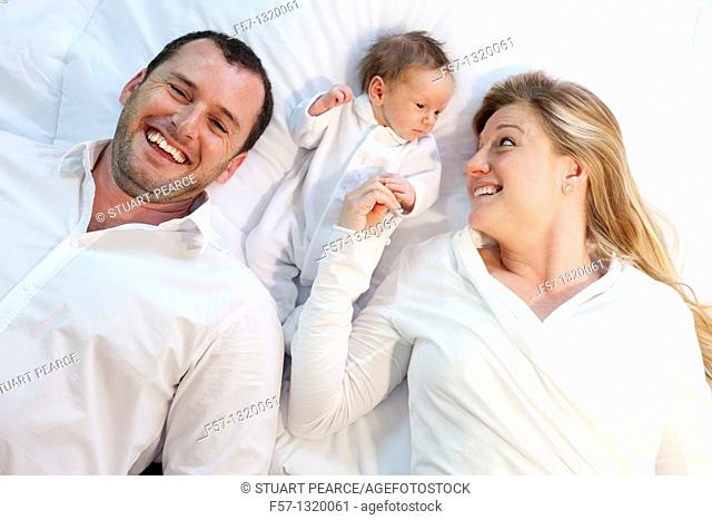 Three week old baby boy with parents