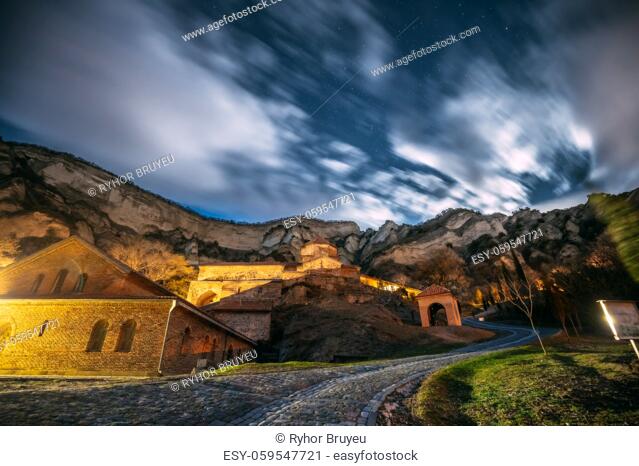 Mtskheta, Georgia. Medieval Monastic Shio-Mgvime Monastery Shiomgvime Complex Under Autumn Night Starry Sky With Glowing Stars And Real Meteoric Track Trail...
