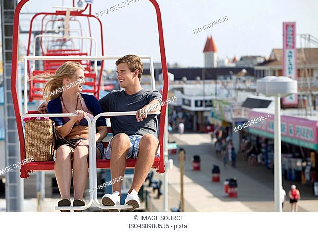 Teenage couple on ferris wheel