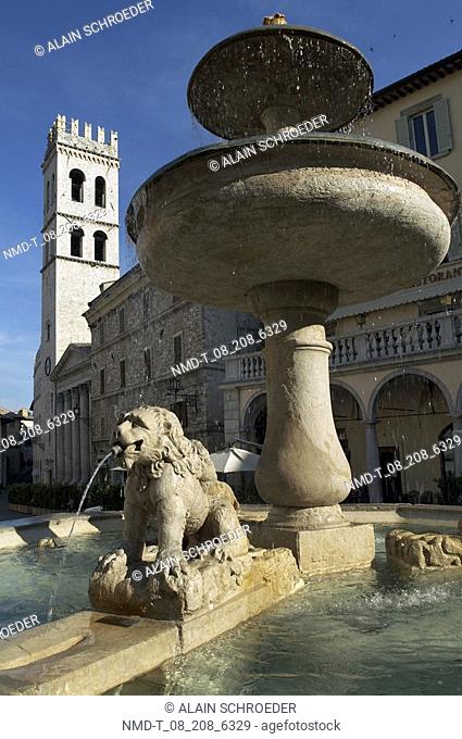 Fountain in front of a temple, Temple Of Minerva, Assisi, Umbria, Italy