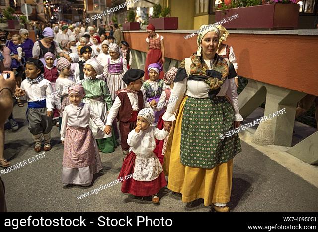 Procession of Saint John towards the Haro square in Les on the Sant Joan night festivity (Les, Aran Valley, Lleida, Catalonia, Spain, Pyrenees)