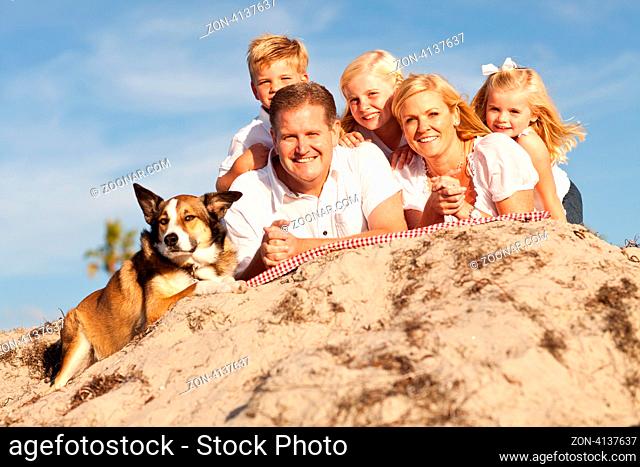 Happy Caucasian Family Portrait at the Beach One Sunny Afternoon