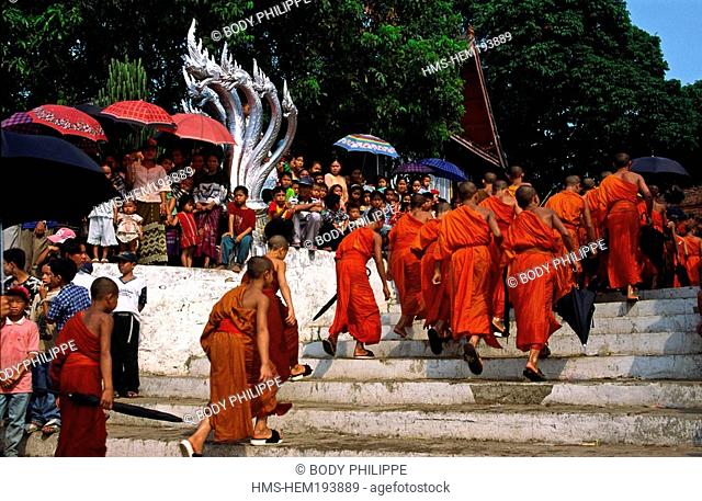 Laos, Luang Prabang, young monks walking in procession during New Year 's feast Pi Mai Lao