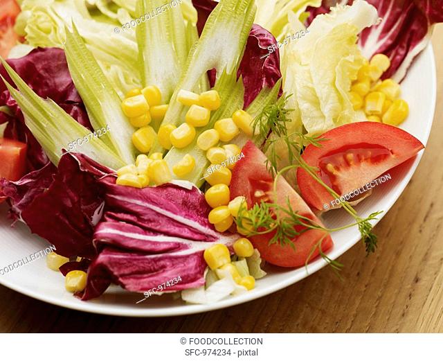 Mixed salad leaves with sweetcorn and tomato