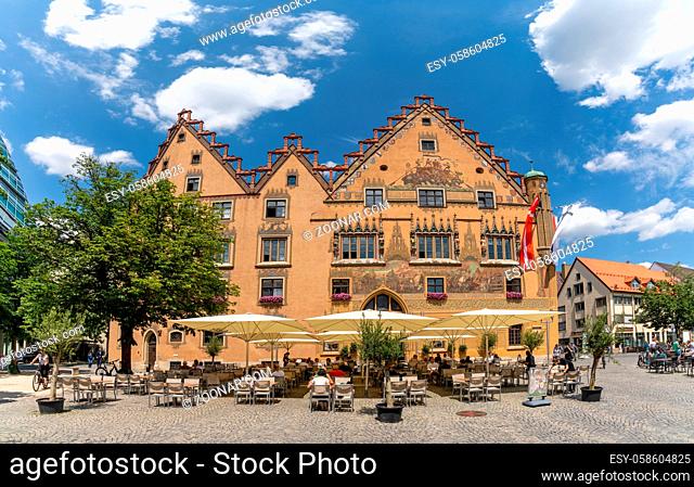 Ulm, BW / Germany - 14 July 2020: the historic town hall building in the city center of Ulm with many people enjoying a day out