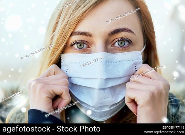 young woman wearing protective medical mask