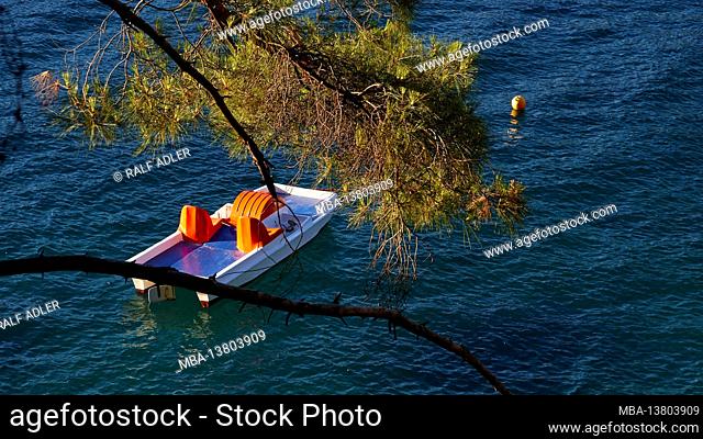 Ionian Islands, Ithaca, island of Odysseus, Vathi, Loutsa Beach, green water, blue water, trees on the beach, lonely beach, pedal boat at anchor