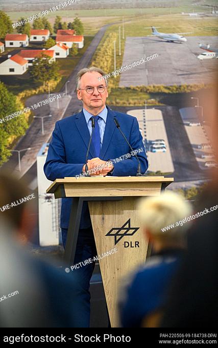 06 May 2022, Saxony-Anhalt, Cochstedt: Reiner Haseloff (CDU) Minister-President of Saxony-Anhalt, addresses guests at the reopening of the German Aerospace...