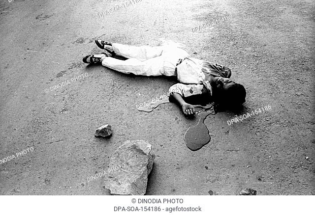 Dead body of man ; communal riots ; Bombay Mumbai ; Maharashtra ; India NO MR