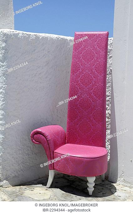 Pink chair, high-backed chair, wall, Fira, Santorini, Greece, Europe, PublicGround