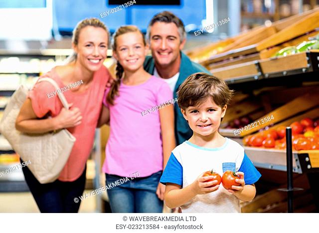 Young family doing some shopping at supermarket