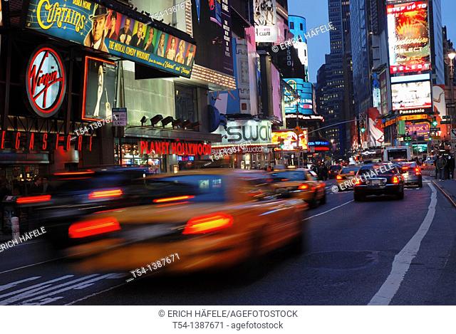 Driving yellow Cabs in the Evening at Time Square in New York