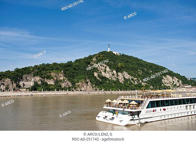 Pleasure boat on river Danube Gellert Hill Budapest Hungary Gellert-hegy Statue of Liberty