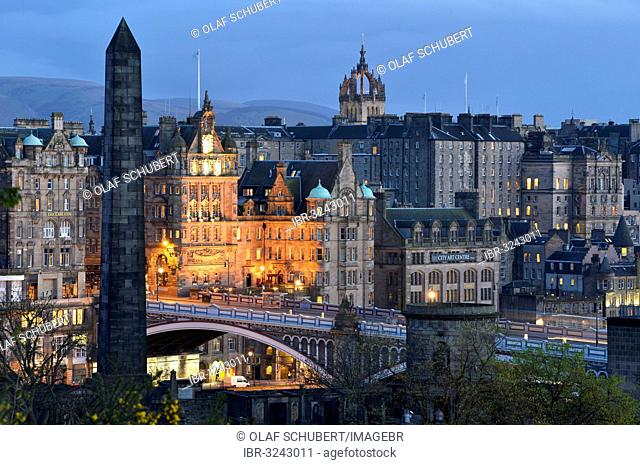 View of the historic centre from Calton Hill with Waverley Station, St Giles Cathedral, the town hall and North Bridge at dusk