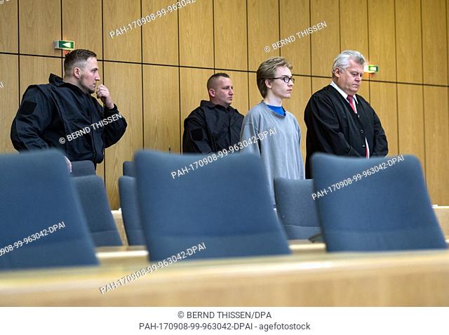 The defendant Marcel H. next to his lawyer Michael Emde (2-R) during the first day of his trial at the district court in Bochum, Germany, 8 September 2017
