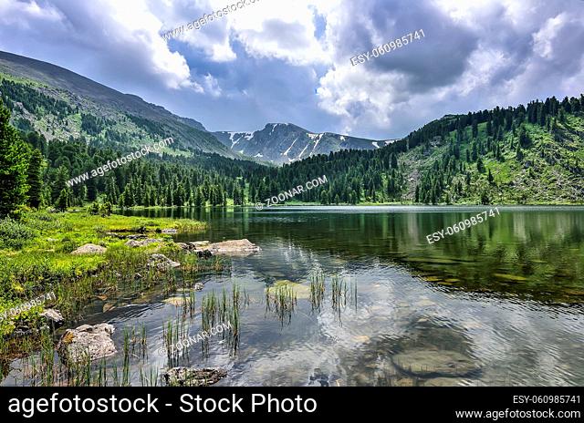 One from seven cleanest mountain Karakol lakes, located in the valley, at the foot of the Bagatash pass, Altai Mountains, Russia
