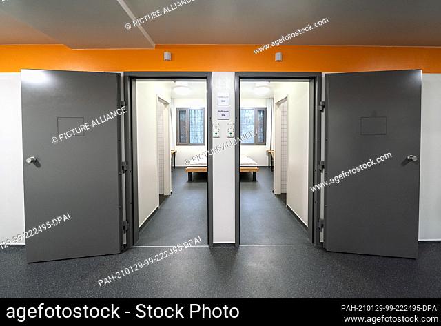 29 January 2021, Hessen, Darmstadt: The doors of two identical detention cells stand open during a preview of the deportation detention centre of the state of...